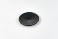 Black BudCups bottom insert with BudTrainer logo and drainage spike for healthy cannabis root growth.