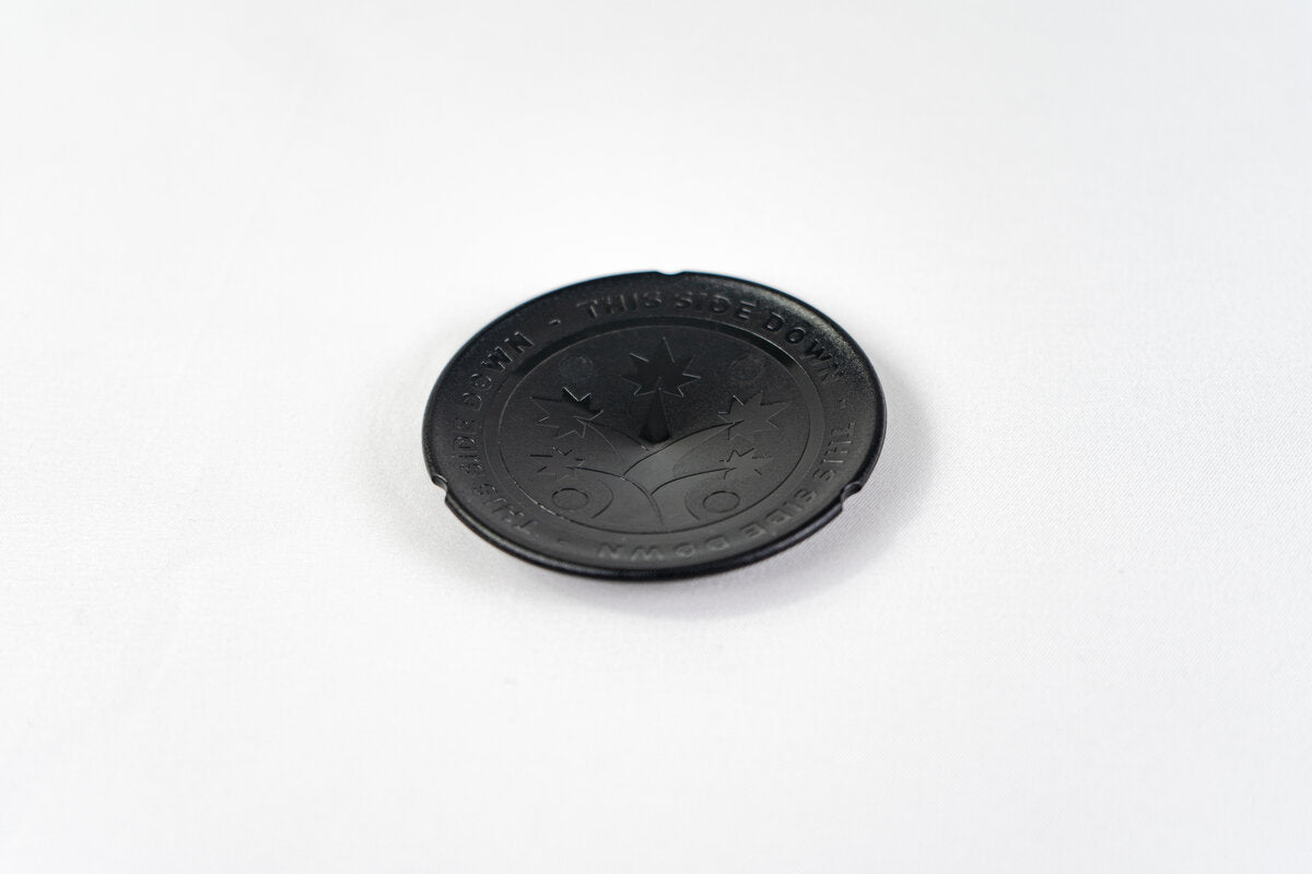 Black BudCups bottom insert with BudTrainer logo and drainage spike for healthy cannabis root growth.
