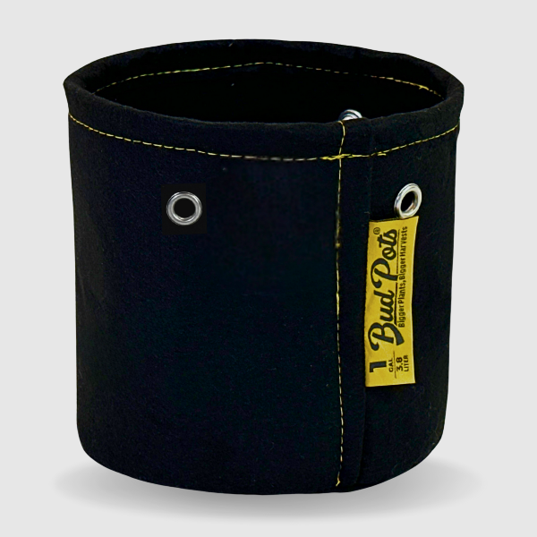 Black fabric pot, BudPots 1Ga, with yellow handles and a visible brand label on a white background