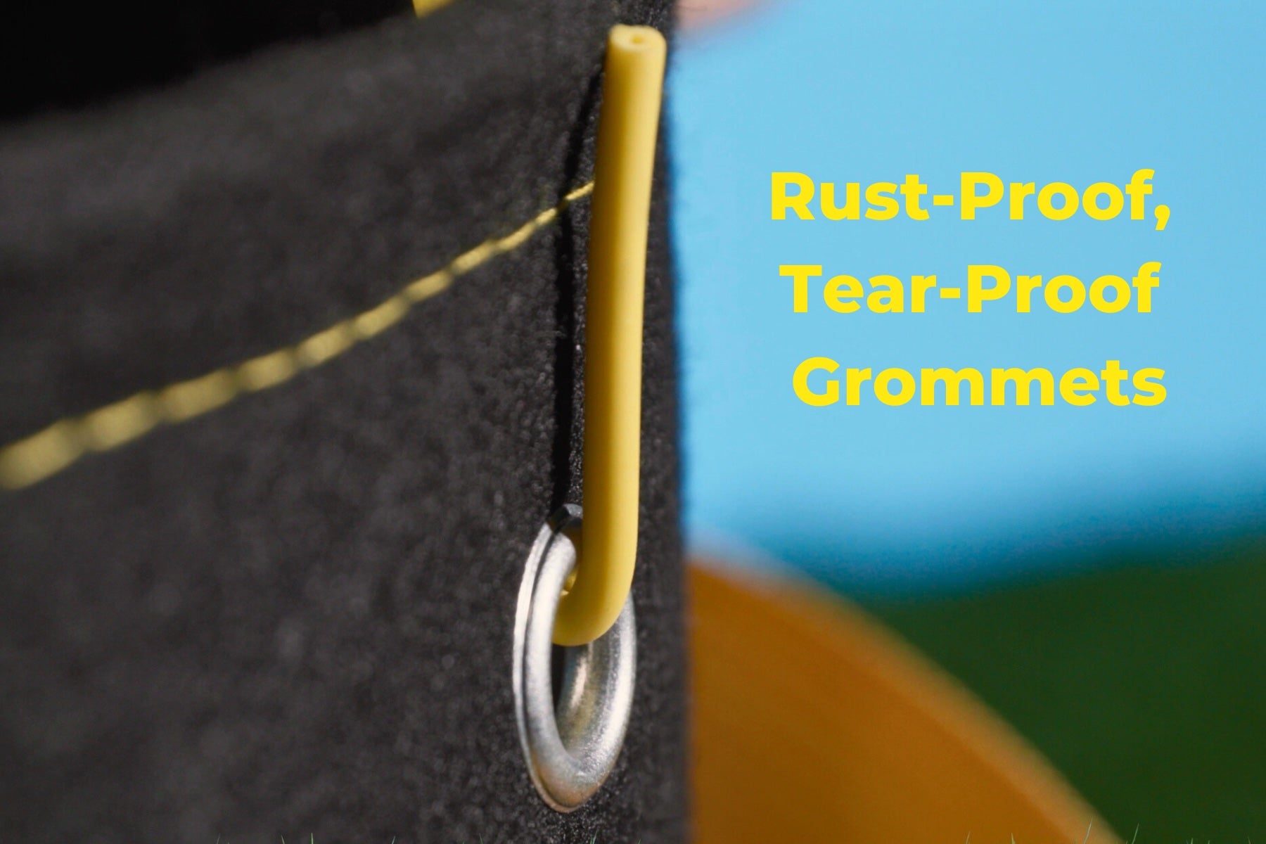 BudPots grommet close up with a BudHuggers garden wire through it and text saying Rust-Proof, Tear-Proof Grommets