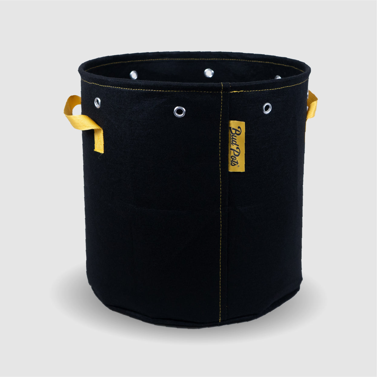 BudTrainer BudPots black fabric grow pot with yellow handles and steel-reinforced rim for home cannabis cultivation.