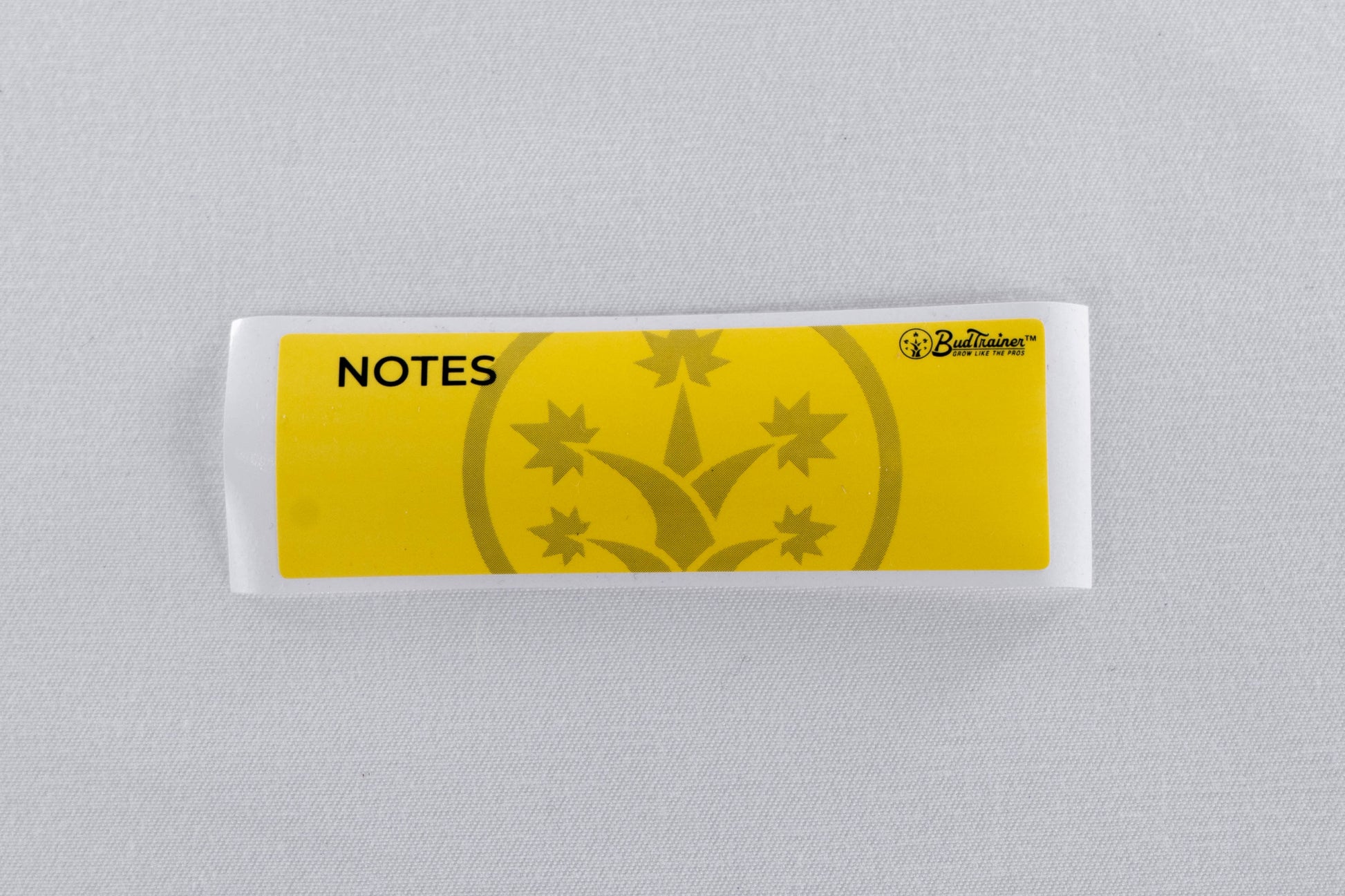 BudTrainer branded yellow sticky notes for cannabis grower reminders and plant tracking.
