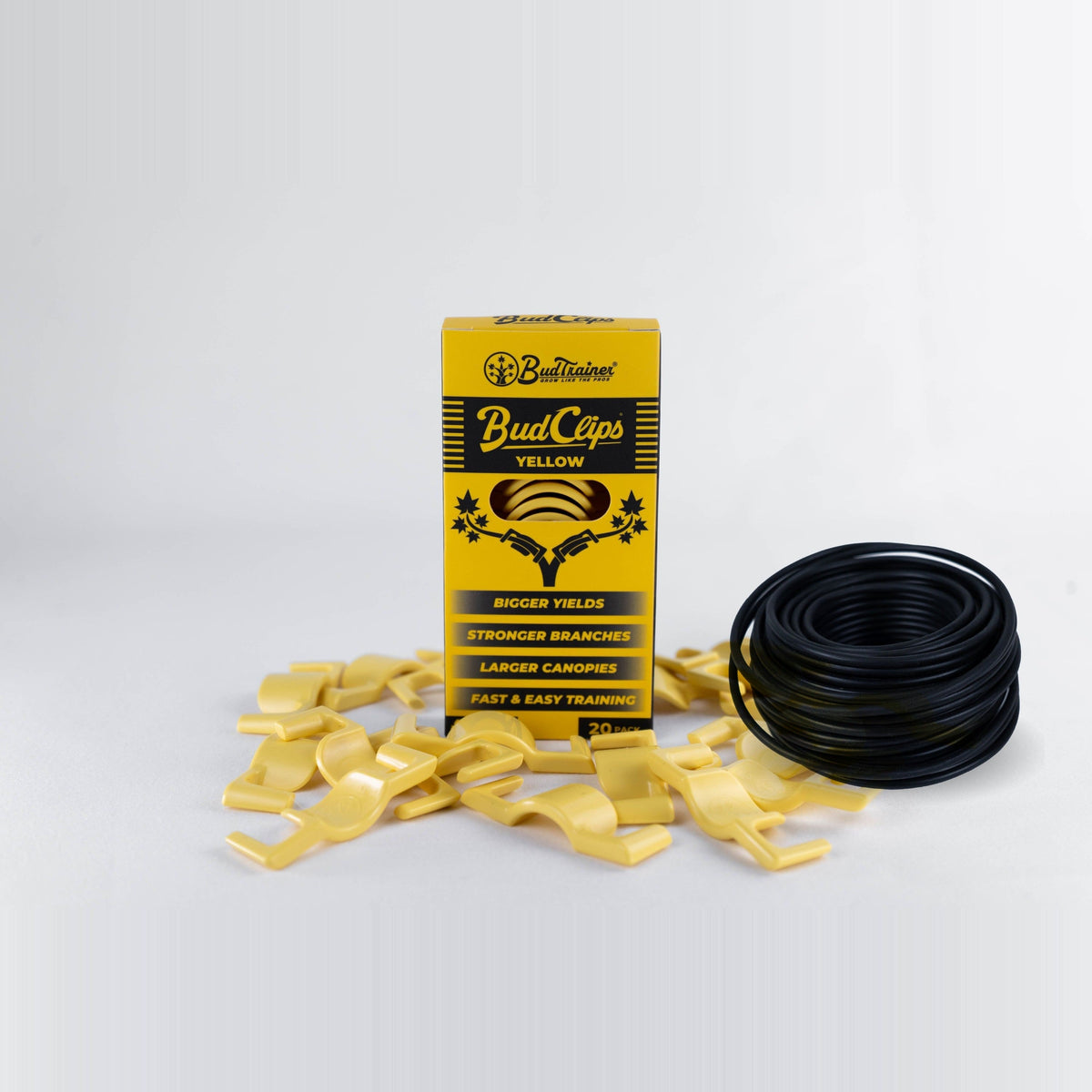 BudClips 20-pack box standing beside a coil of black BudHuggers garden wire, with loose clips at the base